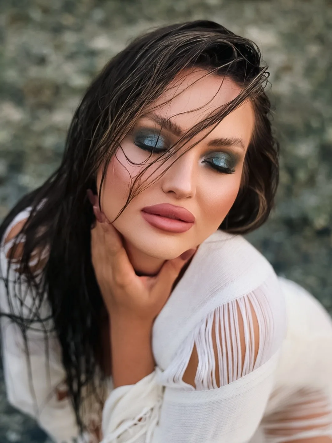 Beauty portrait with blue eye makeup, photographed by Tanya Taskiran