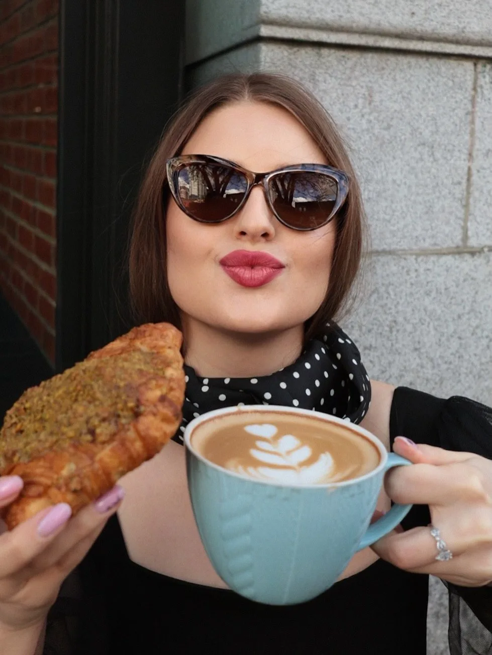 Lifestyle portrait with coffee and a croissant